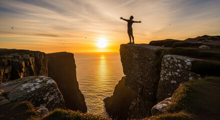 Man on Cliff at Sunset