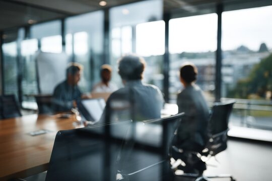Blurred business meeting in modern office with large window city view and collaborative team discussing strategy in bright conference room - Powered by Adobe