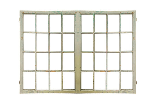 Old multi-pane wooden window frame with peeling light paint is isolated.