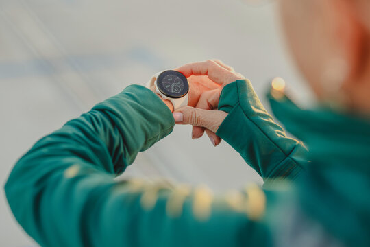 Close-up of woman in sportswear checking smartwatch
- Powered by Adobe