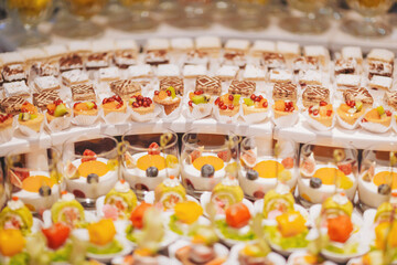 Colorful dessert display showcasing a variety of sweet treats at a banquet during an evening event