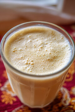 A close-up of Mahewu (fermented maize drink), thick and creamy, a refreshing, traditional non-alcoholic beverage.