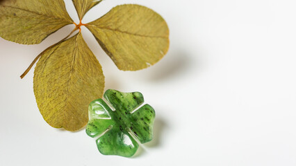 Detail of four-leaf clovers on background