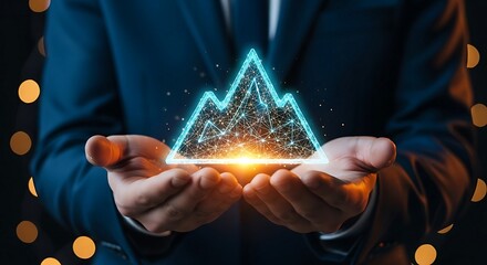 Businessman holding glowing digital mountain symbolizing business growth and technological innovation.