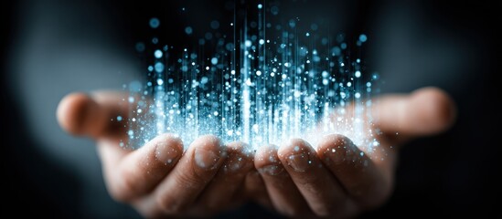 Glowing particles emanating from cupped hands, dark background