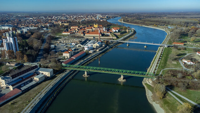 Aerial view of the mighty Drava River snaking through the landscape, bridges connecting the banks, and the historic Osijek Citadel standing proudly, Osijek, Osijek-Baranja County, Croatia.