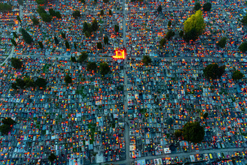 Aerial view of countless candles flicker across the cemetery at dusk, creating a poignant tapestry of light and shadow., Osijek, Osijek-Baranja County, Croatia.