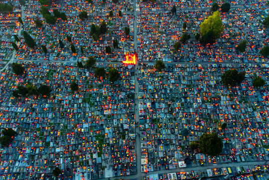 Aerial view of countless candles flicker across the cemetery at dusk, creating a poignant tapestry of light and shadow., Osijek, Osijek-Baranja County, Croatia.