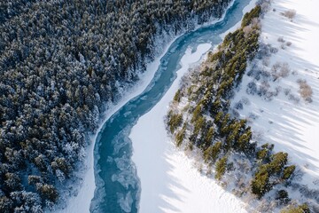 Aerial view of a winding frozen river in a winter landscape