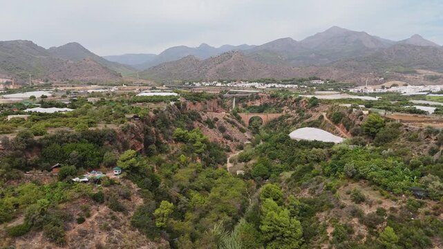 Aerial Drone POV of Nerja coastal town, which is a municipality on the Costa del Sol in the province of Malaga in the autonomous community of Andalusia in southern Spain.