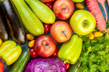 A vibrant overhead display of fresh, colorful fruits and vegetables