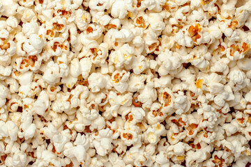 Full frame background texture of fluffy, freshly popped white and yellow popcorn