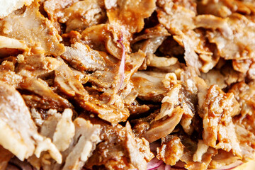 Close-Up View of Juicy Sliced D�ner Kebab Meat on Onion