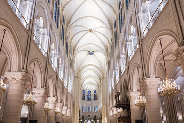 The nave and its beautiful architectural details in the 1345 Gothic style Notre-Dame Cathedral, Paris, France