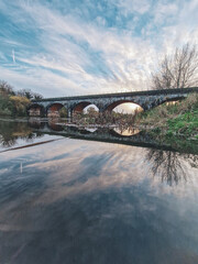 Sunset Reflections on River Trent: Swan Sanctuary, Historic Bridges, and Cloudscape, Burton, UK