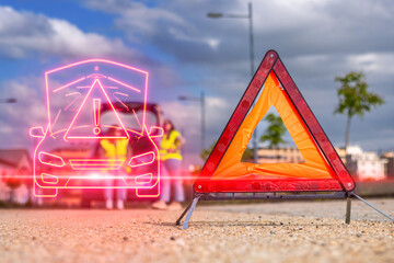 Warning triangle signalling broken car on road with mechanics waiting for roadside assistance