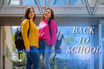 Two female students returning to university after summer holidays