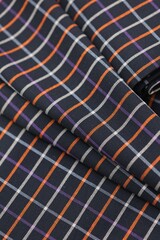 Autumn - winter navy blue plaid wool suiting fabric with a crisp check pattern in orange, purple,...