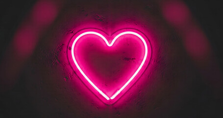 Bright neon pink heart shape glowing in the dark