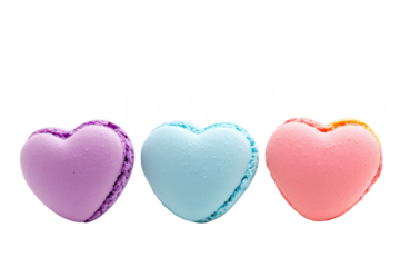 Three colorful heart-shaped macarons arranged in a row. pastel colors of purple. blue. and pink against a clean white background. ideal for dessert-themed projects or celebrations