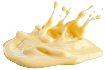 A splash of creamy yellow sauce or condiment. artistically captured mid-air. dynamic motion with droplets suspended. ideal for culinary presentations or food-related content