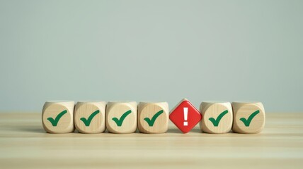 Row of wooden cubes featuring green confirmation marks and one red warning sign presents a concept of error correction