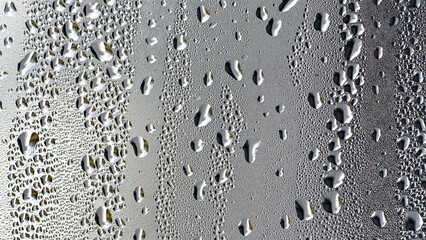 background, drops of morning dew, condensation on the glass. wet glass. water drops close-up. beautiful background for text. Spray cool condensate water on the glas. unusual, abstract. macro photo