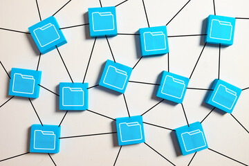 Data storage and file management concept. Network of blue blocks with folder icons connected by lines, symbolizing cloud computing, digital archiving, information organization, and database system.