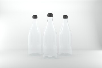 Elegant glass bottles with black caps stand ready for your product designs in a modern, minimalist setting