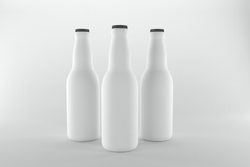 Three blank beer bottles ready for branding and design on a clean white background