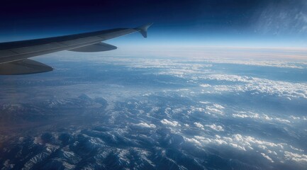 Naklejka premium High-altitude view of Earth's landscape from an airplane
