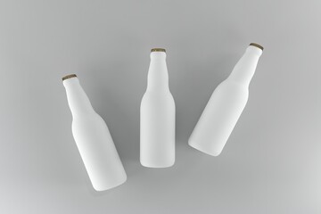 Clean white beer bottles mock up against a neutral background for product design and advertising