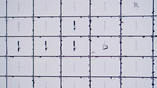 Abstract grid with vertical and horizontal lines forming squares, contains a variety of shapes
