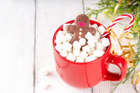 Christmas hot chocolate with marshmallow and chocolate gingerbread man - Powered by Adobe