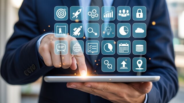 Business professional interacts with a floating holographic interface displaying various application icons on a portable device