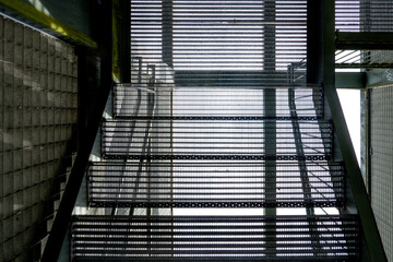 Industrial metal stairs leading upwards abstract pattern