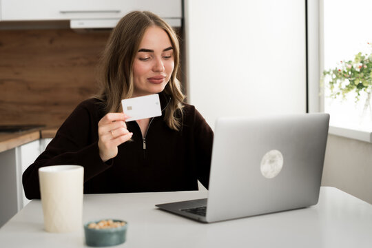 Young woman use laptop with online shopping with credit card for shopping payment. E-commerce, internet banking and technology