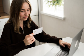 Young woman use laptop with online shopping with credit card for shopping payment. E-commerce, internet banking and technology