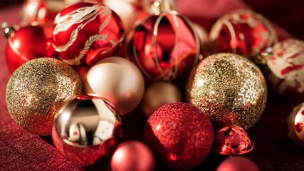 Close up of festive Christmas ornaments in red and gold, baubles resting on red fabric, warm holiday decor with sparkling highlights for seasonal celebration and cozy ambiance - Powered by Adobe