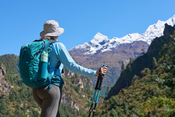 Backpacker Admiring Himalayas on Trek to Everest Base Camp, Nepal.