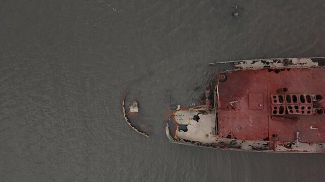 overhead flying right over decaying boat in Staten Island Boat Graveyard