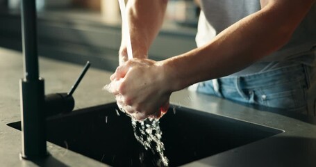 Washing, water and hands of person in kitchen for cleaning, hygiene and disinfection for germs. Home, faucet and man for dirt removal, protection and bacteria prevention for health and wellness - Powered by Adobe