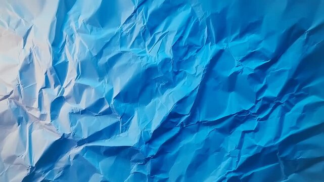 Abstract blue crumpled paper texture with soft gradient lighting and subtle folds, creating a versatile background for design, branding, presentations, and digital art projects