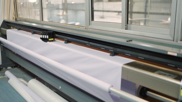 Industrial Wide Format Printer Working on White Tent Fabric or Banner