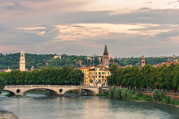 View of Bridge of the Victory ( Ponte della Vittoria ) in old city of Verona, Italy under a cloudy sky at sunset.