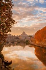Autumn and foliage in Rome. Beautiful sycamore orange leaves along River Tiber in mist during sunset