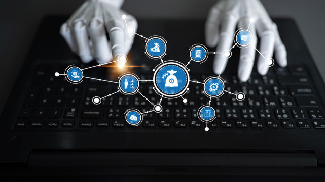 Robotic hands interact with a laptop keyboard, showcasing the intersection of technology and human enhancement, symbolizing the future of digital interaction and innovation. Tessel