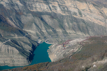 Turquoise expanse amidst cliffs: canyon reservoir