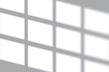 Soft sunlight streaming through modern window creates calming shadows on wall for minimalist background