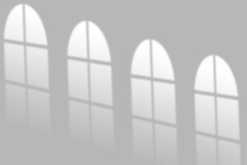 Soft sunlight casts arched window shadows creating a serene, modern backdrop for your design projects.